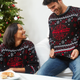 Lifestyle shot of two people in Krispy Kreme holiday sweaters